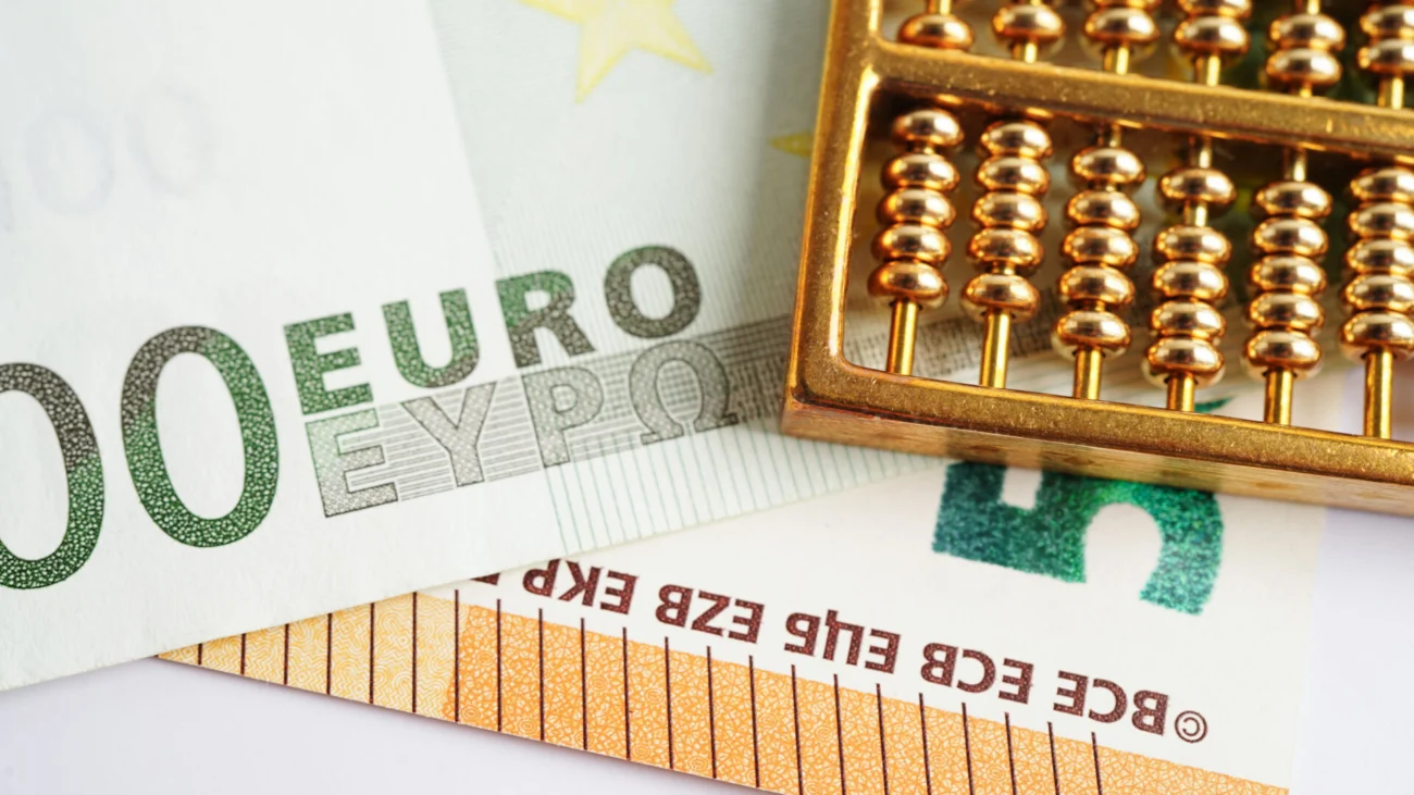 Gold abacus on banknote money, finance trading investment busine